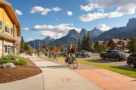 canmore mountains, sidewalk, bike path, and homes