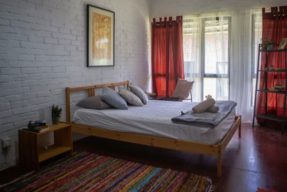 Bed with beautiful walk out windows