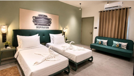 two beds and a painting