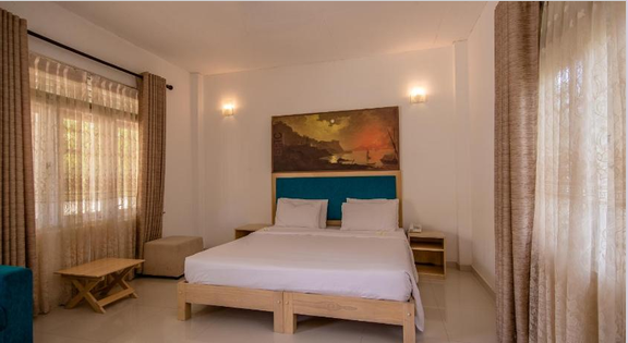 Big bed with painting over top